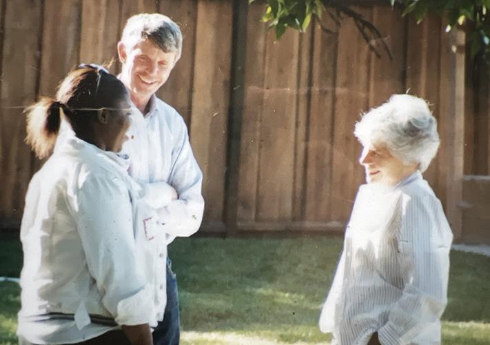 Dick and Sue Jacobsen (founders) talking happily with a woman